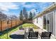 Inviting backyard featuring a cozy patio seating area and lush lawn, perfect for outdoor relaxation and entertainment at 7260 Blue Ridge Dr, Noblesville, IN 46062