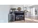 Elegant bar area with a wine fridge and stylish decor, seamlessly integrated with the open-concept kitchen at 7260 Blue Ridge Dr, Noblesville, IN 46062