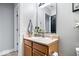 Bathroom featuring vanity with sink, updated faucet, framed mirror, and neutral decor at 7260 Blue Ridge Dr, Noblesville, IN 46062