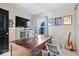 Bedroom featuring a large desk, a TV with display console and natural light from a window with sports decor at 7260 Blue Ridge Dr, Noblesville, IN 46062