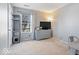 Bedroom featuring carpeted floors, a dresser with TV, and a window with natural light at 7260 Blue Ridge Dr, Noblesville, IN 46062