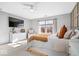 Bright bedroom featuring a ceiling fan, large windows, a dresser, and a TV for a relaxing retreat at 7260 Blue Ridge Dr, Noblesville, IN 46062