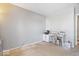 Neutral-toned bedroom features carpeted floors and a versatile workspace with a simple desk and white storage unit at 7260 Blue Ridge Dr, Noblesville, IN 46062