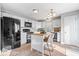Well-lit kitchen features modern appliances, ample cabinet space, and a functional island with seating at 7260 Blue Ridge Dr, Noblesville, IN 46062