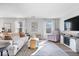 Bright living room featuring lots of seating, natural light, and hardwood floors at 7260 Blue Ridge Dr, Noblesville, IN 46062