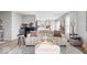 Bright living room featuring a cozy sofa, modern decor, and an open layout connected to the kitchen at 7260 Blue Ridge Dr, Noblesville, IN 46062