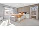 Serene main bedroom with modern paneling, neutral tones, and comfortable furniture and ample natural light at 7260 Blue Ridge Dr, Noblesville, IN 46062