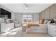 Inviting main bedroom with paneled wall, neutral decor, and comfortable seating and ample natural light at 7260 Blue Ridge Dr, Noblesville, IN 46062