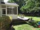 Backyard with a screened in porch, deck and landscaping at 7336 Hardin Oak Dr, Noblesville, IN 46062