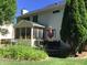 Home's backyard showcasing deck featuring mature landscaping, barbecue and patio dining at 7336 Hardin Oak Dr, Noblesville, IN 46062