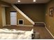 Finished basement featuring carpet, storage, and refrigerator under staircase at 7336 Hardin Oak Dr, Noblesville, IN 46062