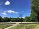 Community basketball court ready for a game with two hoops and ample space at 7336 Hardin Oak Dr, Noblesville, IN 46062