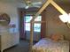 Bright bedroom with a house frame bed, white dresser, and pink accents at 7336 Hardin Oak Dr, Noblesville, IN 46062