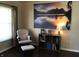 Comfortable living room with a cozy chair, bookshelf, and natural light from the window at 7336 Hardin Oak Dr, Noblesville, IN 46062