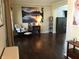 Spacious living room featuring hardwood floors, a cozy chair, and a large wall art at 7336 Hardin Oak Dr, Noblesville, IN 46062