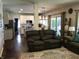Open concept living room flows to the kitchen with modern appliances and finishes at 7336 Hardin Oak Dr, Noblesville, IN 46062