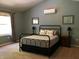 Cozy main bedroom featuring soft colors, accent mirrors and a comfortable bed at 7336 Hardin Oak Dr, Noblesville, IN 46062