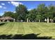 Well-maintained community pool area with seating and a covered structure for relaxation at 7336 Hardin Oak Dr, Noblesville, IN 46062