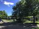 Community pool area featuring sun loungers, umbrellas, and a changing cabana at 7336 Hardin Oak Dr, Noblesville, IN 46062