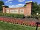 Community entrance sign for Oakmont of Noblesville with manicured flower beds at 7336 Hardin Oak Dr, Noblesville, IN 46062