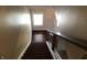 A staircase with wood steps and a modern metal and wood railing leading upstairs at 7336 Hardin Oak Dr, Noblesville, IN 46062