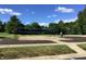 Sand volleyball court in the community's common area. The court has a net and a trash can nearby at 7336 Hardin Oak Dr, Noblesville, IN 46062