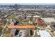 An aerial view displays a school campus with traditional brick buildings, green spaces, and downtown buildings in the distance at 774 Woodruff Pl E Dr, Indianapolis, IN 46201