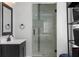 Modern bathroom featuring a sleek vanity and a frameless glass shower with stylish tile accents at 774 Woodruff Pl E Dr, Indianapolis, IN 46201