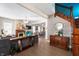 Open concept living space with wooden staircase, fireplace, and dining room at 774 Woodruff Pl E Dr, Indianapolis, IN 46201