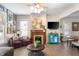 Inviting living room with cozy seating, decorative fireplace, and natural light at 774 Woodruff Pl E Dr, Indianapolis, IN 46201
