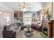 Spacious living room featuring ample natural light, fireplace, and cozy seating at 774 Woodruff Pl E Dr, Indianapolis, IN 46201