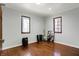 Bedroom featuring hardwood floors and natural light from two windows at 7916 W 275 N, Boggstown, IN 46110