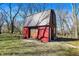 Garage exterior view with a unique roofline and rustic charm at 7916 W 275 N, Boggstown, IN 46110