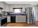 Bright kitchen with stainless steel appliances, ample counter space, and classic cabinetry at 7916 W 275 N, Boggstown, IN 46110