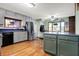 Well-lit kitchen includes stainless steel appliances, an island with seating, and ample cabinet space at 7916 W 275 N, Boggstown, IN 46110