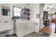 Laundry room with washer, dryer, sink and shelving at 7916 W 275 N, Boggstown, IN 46110