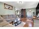 Spacious living room with hardwood floors, a wood burning stove, and ample natural light for a cozy feel at 7916 W 275 N, Boggstown, IN 46110