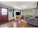 Comfortable living room with hardwood floors, a large window, and a cozy atmosphere for relaxation at 7916 W 275 N, Boggstown, IN 46110