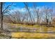 Scenic view of a wide, muddy river surrounded by bare trees in a tranquil setting at 7916 W 275 N, Boggstown, IN 46110
