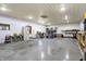 Large workshop area with bright lighting, offering substantial space for projects and storage at 7916 W 275 N, Boggstown, IN 46110