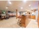 Basement entertainment area featuring a custom bar and ample seating at 7984 S Deer Lake Dr, Nineveh, IN 46164