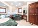 Elegant bathroom featuring a marble-surround tub, dual vanities, natural light, and wood accents at 7984 S Deer Lake Dr, Nineveh, IN 46164