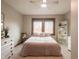Cozy bedroom with a large window, soft lighting, and neutral tones, creating a relaxing atmosphere at 7984 S Deer Lake Dr, Nineveh, IN 46164