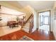 Stunning foyer featuring hardwood floors and staircase views to the dining room at 7984 S Deer Lake Dr, Nineveh, IN 46164