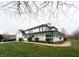 Two-story home featuring a large wrap around front porch and well-manicured lawn at 7984 S Deer Lake Dr, Nineveh, IN 46164
