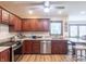 Well-equipped kitchen with stainless steel appliances, granite countertops, and custom cabinetry at 7984 S Deer Lake Dr, Nineveh, IN 46164