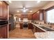 Spacious kitchen with wood cabinets, stainless appliances and granite countertops at 7984 S Deer Lake Dr, Nineveh, IN 46164