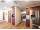 Kitchen and pantry area with stainless fridge and wood floors at 7984 S Deer Lake Dr, Nineveh, IN 46164