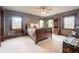 Spacious main bedroom with multiple windows, ceiling fan, and warm tones at 7984 S Deer Lake Dr, Nineveh, IN 46164