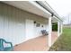 Covered porch boasts a welcoming swing, enhancing the outbuilding's charm with overhead lighting and inviting ambiance at 7984 S Deer Lake Dr, Nineveh, IN 46164